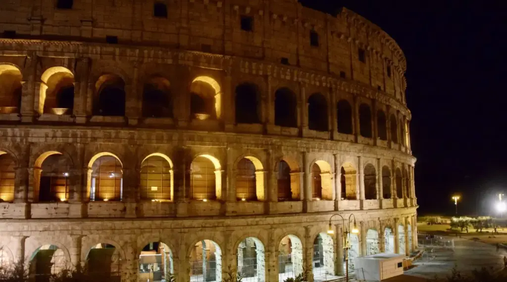 The Colosseum illuminated at night in Rome