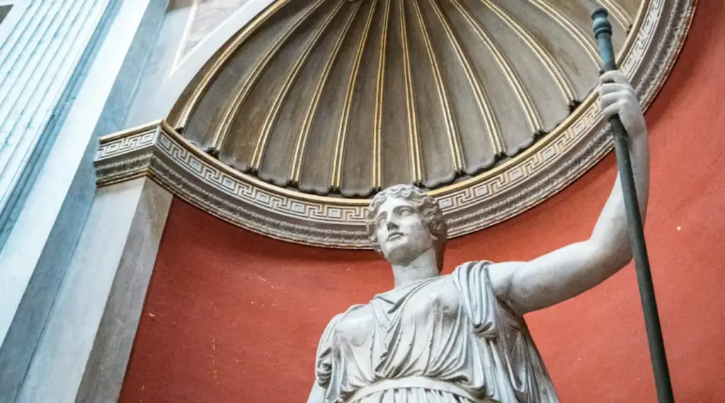Classical marble statue beneath an ornate dome in Rome