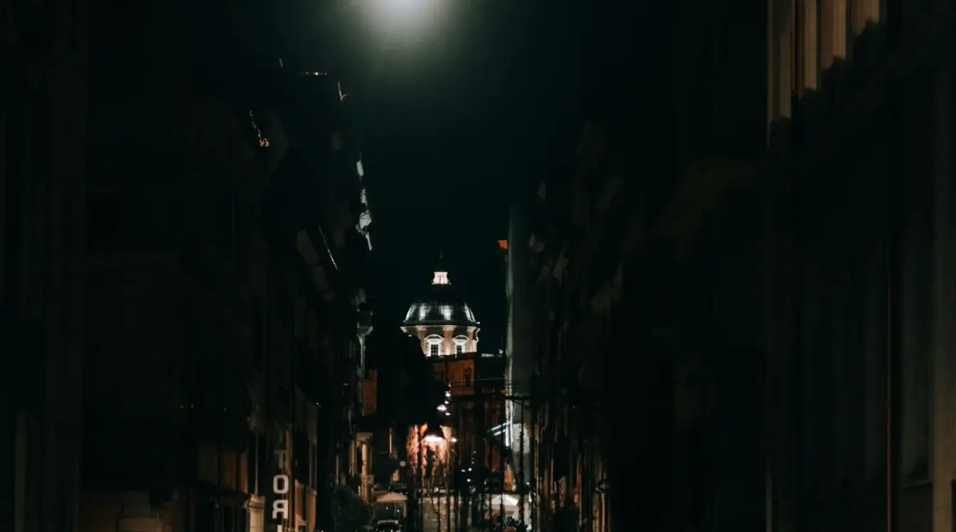 Rome street at night illuminated by street lights